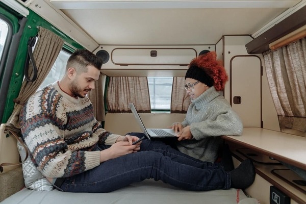 Couple working in an RV