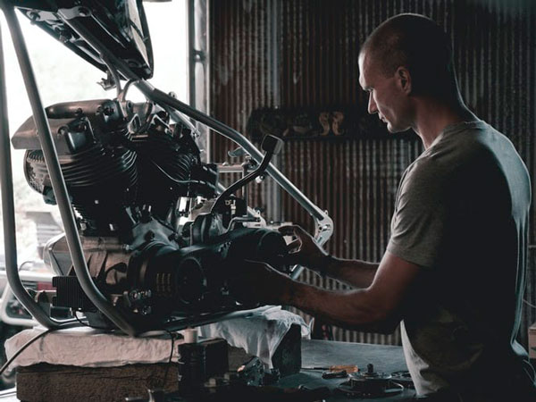 a man doing DIY car maintenance