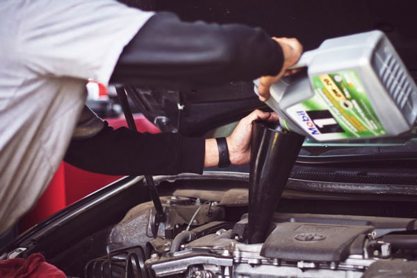 a person doing home car repairs