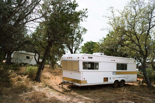 two campers in the woods